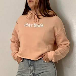Women Crop hoodie in peach color with a  design in HTV, size M,new never used